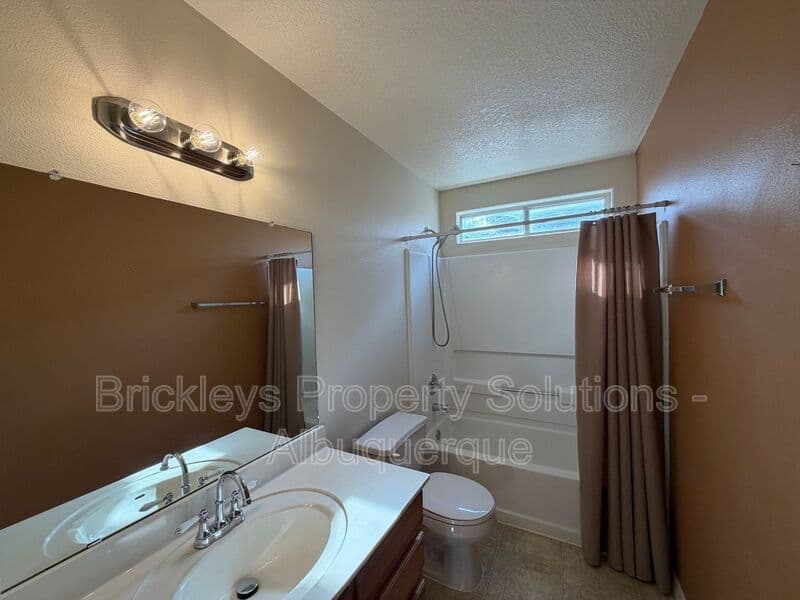 3-bedroom 2-bath home at 7704 Woodstar Ave NW for $1,825/mo managed by Brickleys Property Solutions Albuquerque — photo 17 of 28
