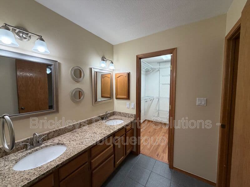 3-bedroom 2.5-bath home at 9600 Allande Rd NE for $3,200/mo managed by Brickleys Property Solutions Albuquerque — photo 33 of 40