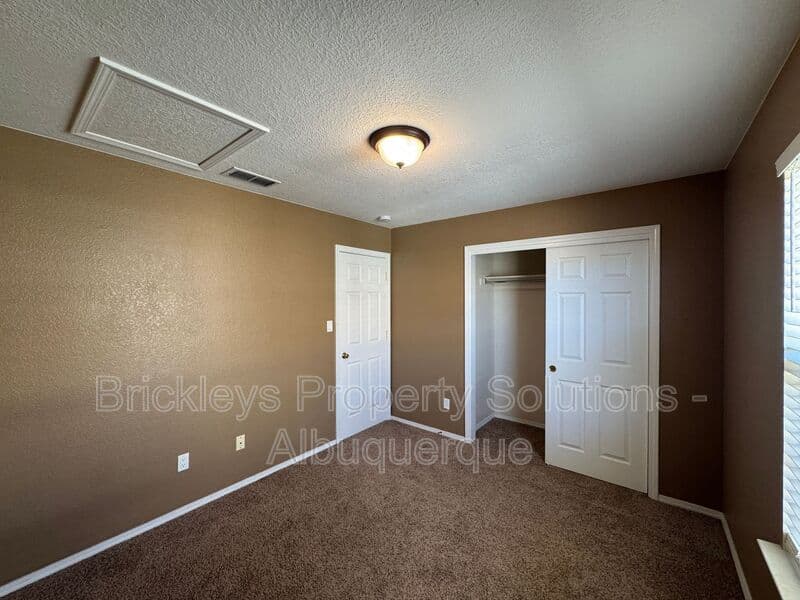 4-bedroom 3-bath home at 7131 Wild Olive Ave NE for $2,900/mo managed by Brickleys Property Solutions Albuquerque — photo 25 of 38