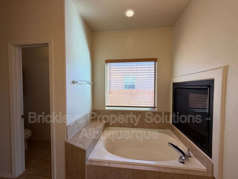 4-bedroom 3.5-bath home at 6228 Nacional Rd NW for $2,700/mo managed by Brickleys Property Solutions Albuquerque — photo 31 of 44