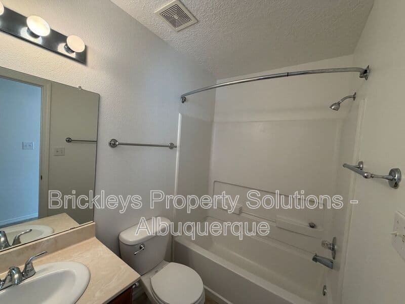 4-bedroom 3-bath home at 6027 Park South Pl NW for $2,400/mo managed by Brickleys Property Solutions Albuquerque — photo 9 of 36