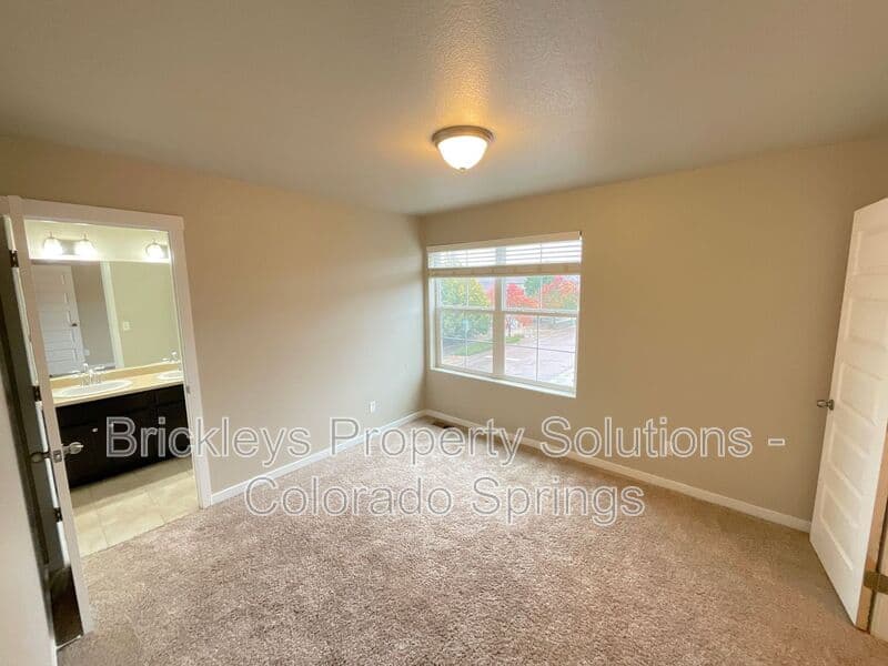 3-bedroom 2.5-bath home at 2401 Ellingwood Dr for $2,233/mo total (includes $2,195 base rent + $38 required Tenant Benefit Package) managed by Brickleys Property Solutions Colorado Springs — photo 32 of 40
