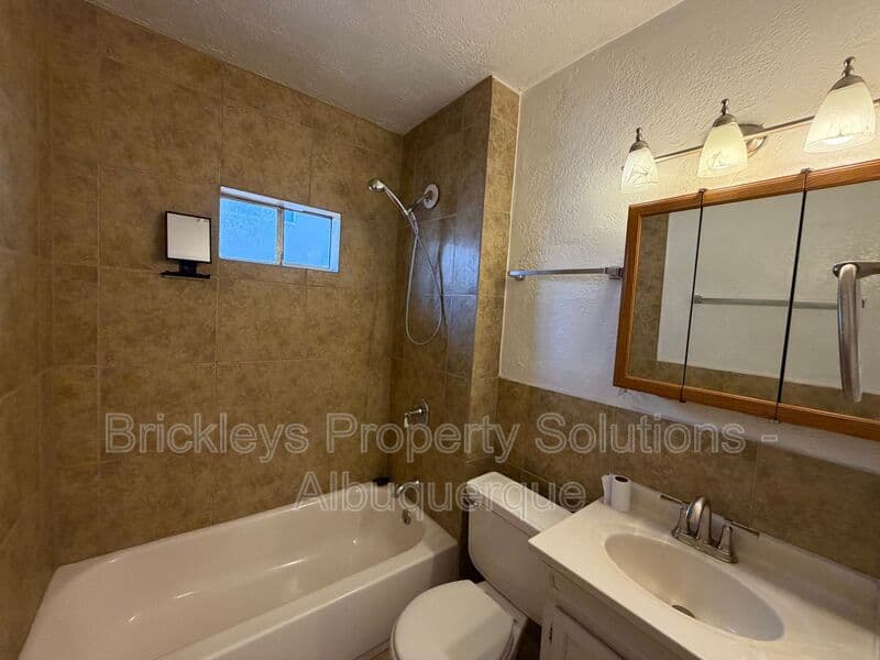 4-bedroom 2-bath home at 313 Cornell Drive SE Unit A for $1,600/mo managed by Brickleys Property Solutions Albuquerque — photo 13 of 27