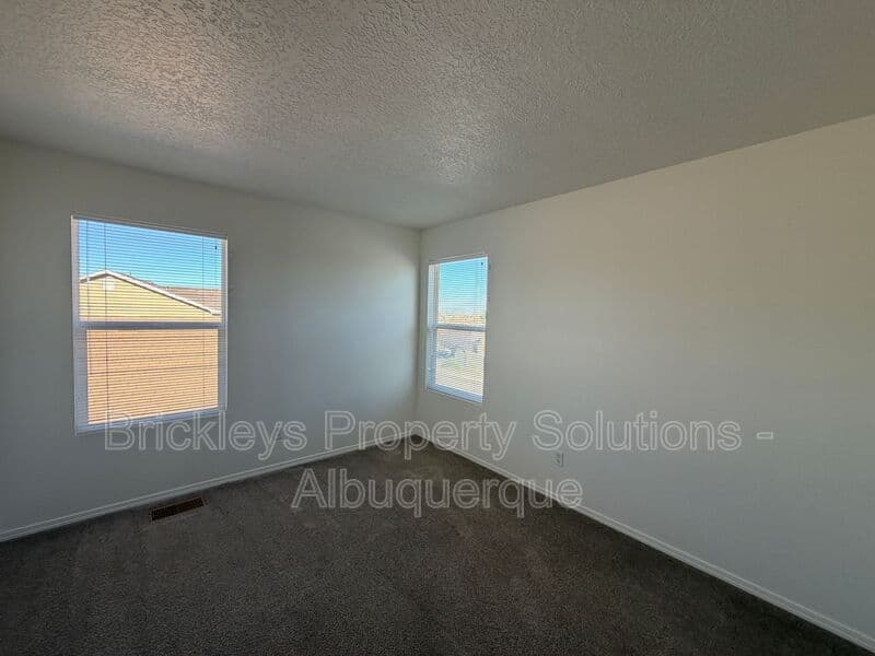 4-bedroom 3-bath home at 6027 Park South Pl NW for $2,400/mo managed by Brickleys Property Solutions Albuquerque — photo 32 of 36