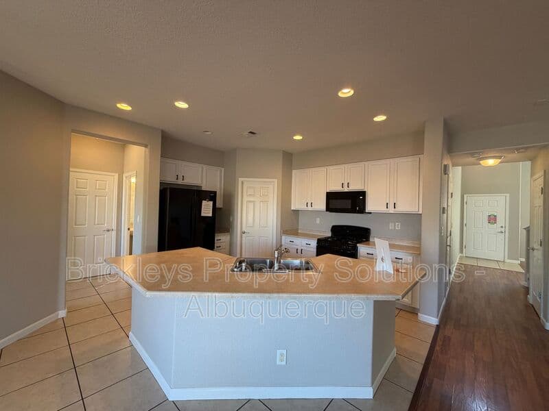 3-bedroom 2.5-bath home at 418 Paseo Roja Pl NE for $2,375/mo managed by Brickleys Property Solutions Albuquerque — photo 33 of 42