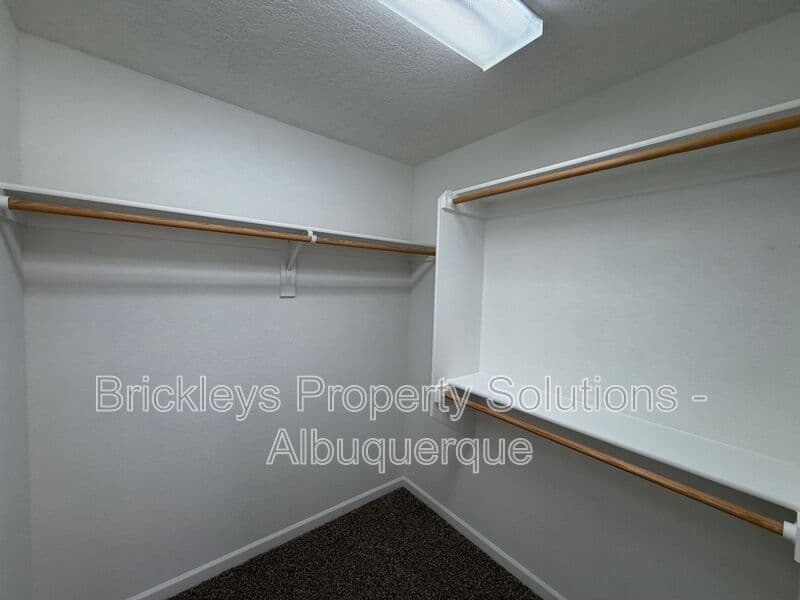 3-bedroom 2.5-bath home at 418 Paseo Roja Pl NE for $2,375/mo managed by Brickleys Property Solutions Albuquerque — photo 25 of 42