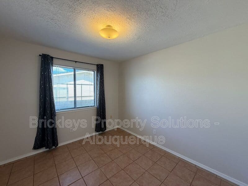 4-bedroom 2-bath home at 5812 Brahma Dr NW for $1,950/mo managed by Brickleys Property Solutions Albuquerque — photo 17 of 35