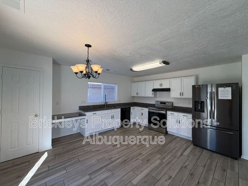 4-bedroom 3-bath home at 6027 Park South Pl NW for $2,400/mo managed by Brickleys Property Solutions Albuquerque — photo 14 of 36