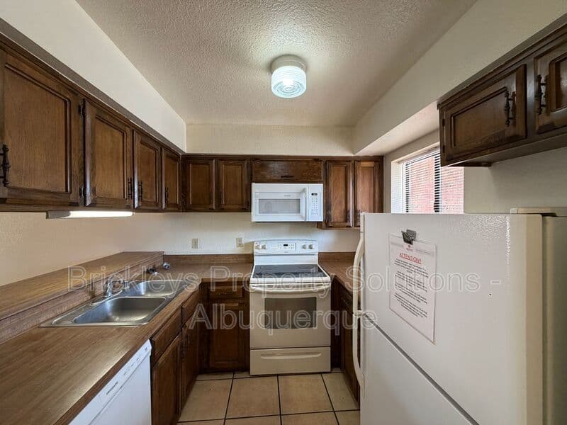 3-bedroom 2-bath home at 9937 Clearwater St. NW for $1,900/mo managed by Brickleys Property Solutions Albuquerque — photo 18 of 27
