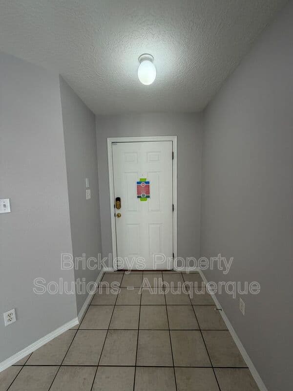 3-bedroom 2-bath home at 10601 Rio Del Sole Ct NW for $2,000/mo managed by Brickleys Property Solutions Albuquerque — photo 4 of 29