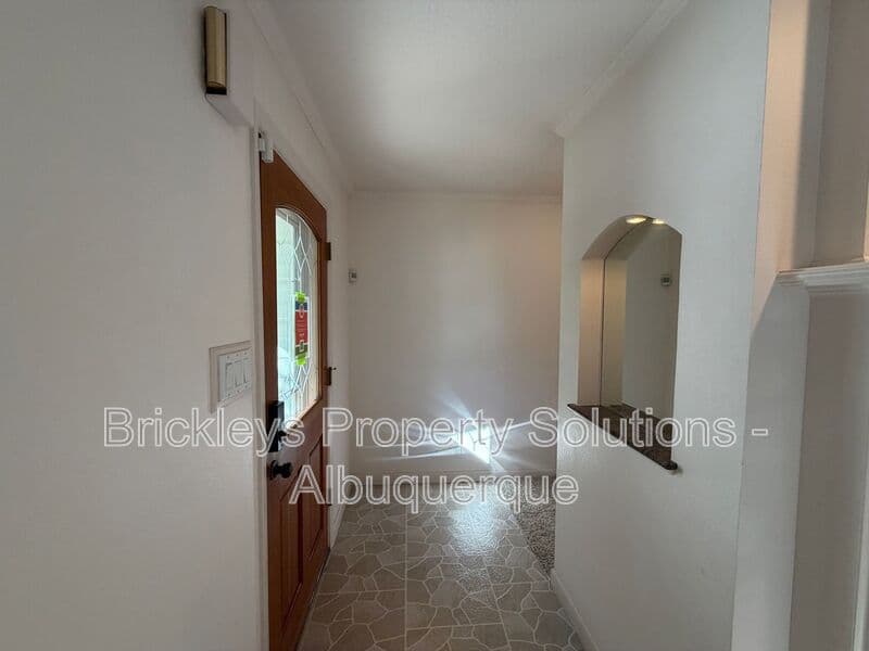 4-bedroom 3-bath home at 7121 Edwina Ave NE for $2,450/mo managed by Brickleys Property Solutions Albuquerque — photo 5 of 47