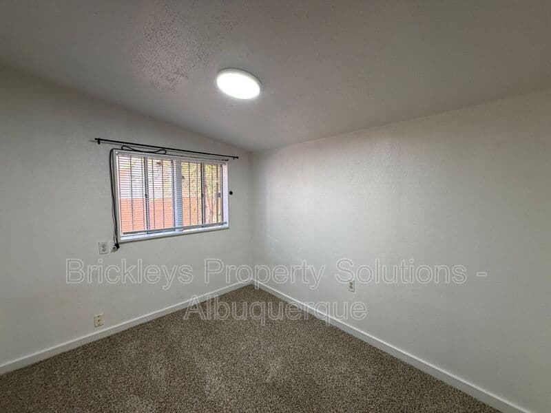 4-bedroom 2-bath home at 313 Cornell Drive SE Unit A for $1,600/mo managed by Brickleys Property Solutions Albuquerque — photo 20 of 27