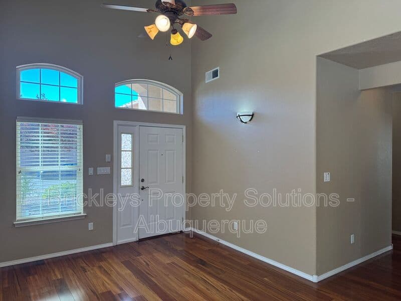 4-bedroom 3-bath home at 7131 Wild Olive Ave NE for $2,900/mo managed by Brickleys Property Solutions Albuquerque — photo 5 of 38