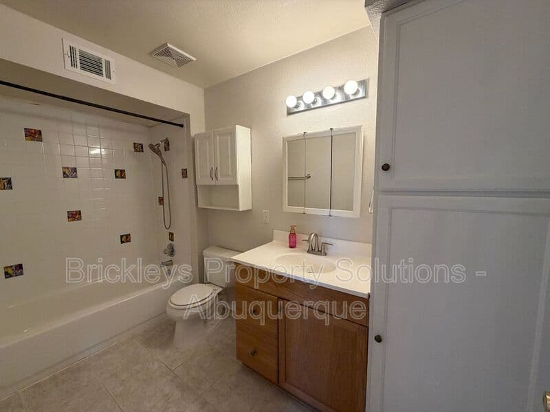 4-bedroom 2-bath home at 5812 Brahma Dr NW for $1,950/mo managed by Brickleys Property Solutions Albuquerque — photo 8 of 35