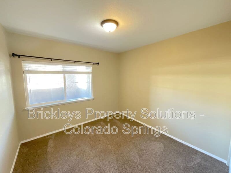 3-bedroom 2-bath home at 3780 Riviera Grove Unit #104 for $1,863/mo total (includes $1,825 base rent + $38 required Tenant Benefit Package) managed by Brickleys Property Solutions Colorado Springs — photo 17 of 24