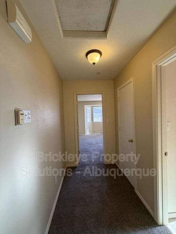 3-bedroom 2-bath home at 7704 Woodstar Ave NW for $1,825/mo managed by Brickleys Property Solutions Albuquerque — photo 12 of 28