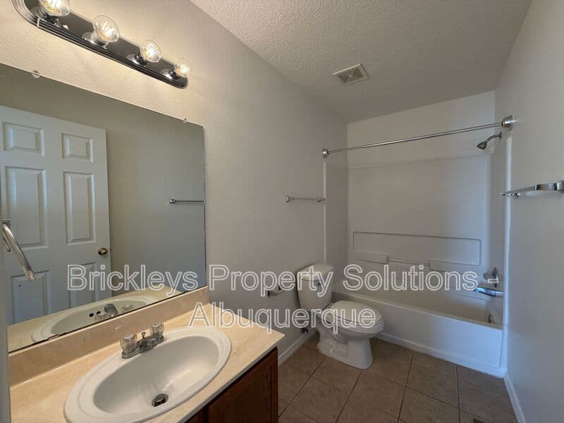 4-bedroom 3-bath home at 6027 Park South Pl NW for $2,400/mo managed by Brickleys Property Solutions Albuquerque — photo 34 of 36