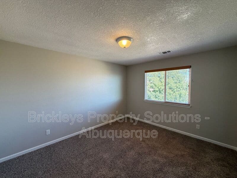 3-bedroom 2.5-bath home at 418 Paseo Roja Pl NE for $2,375/mo managed by Brickleys Property Solutions Albuquerque — photo 9 of 42