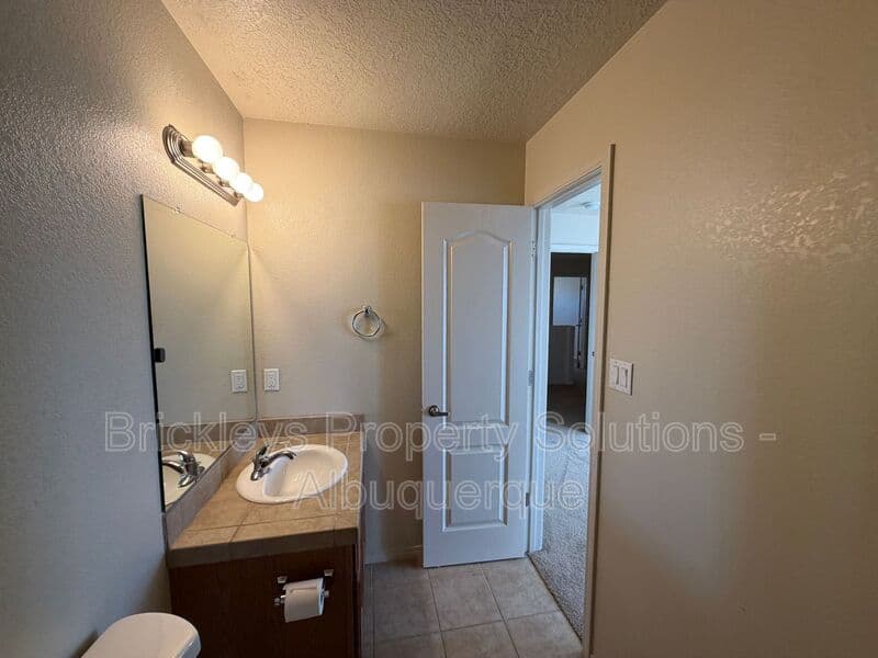 4-bedroom 3.5-bath home at 6228 Nacional Rd NW for $2,700/mo managed by Brickleys Property Solutions Albuquerque — photo 16 of 44