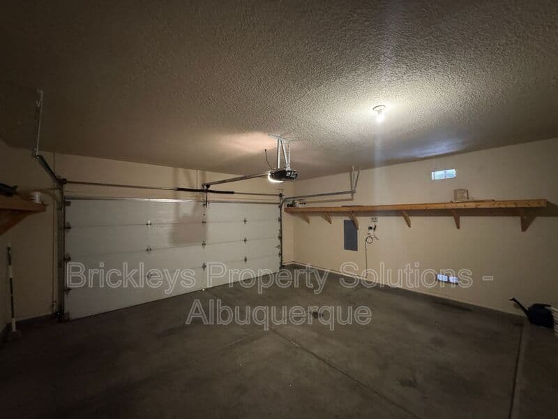 4-bedroom 3-bath home at 7131 Wild Olive Ave NE for $2,900/mo managed by Brickleys Property Solutions Albuquerque — photo 33 of 38