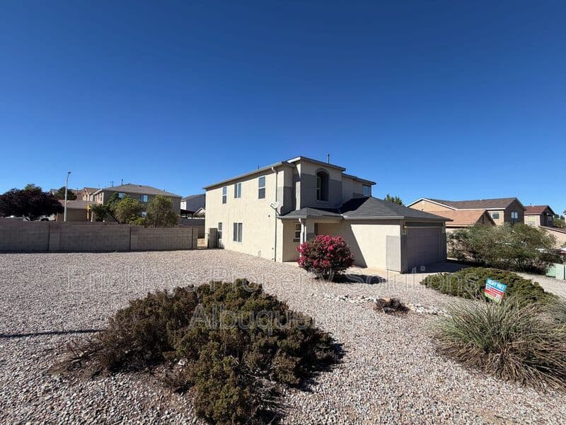 4-bedroom 3-bath home at 6027 Park South Pl NW for $2,400/mo managed by Brickleys Property Solutions Albuquerque — photo 2 of 36