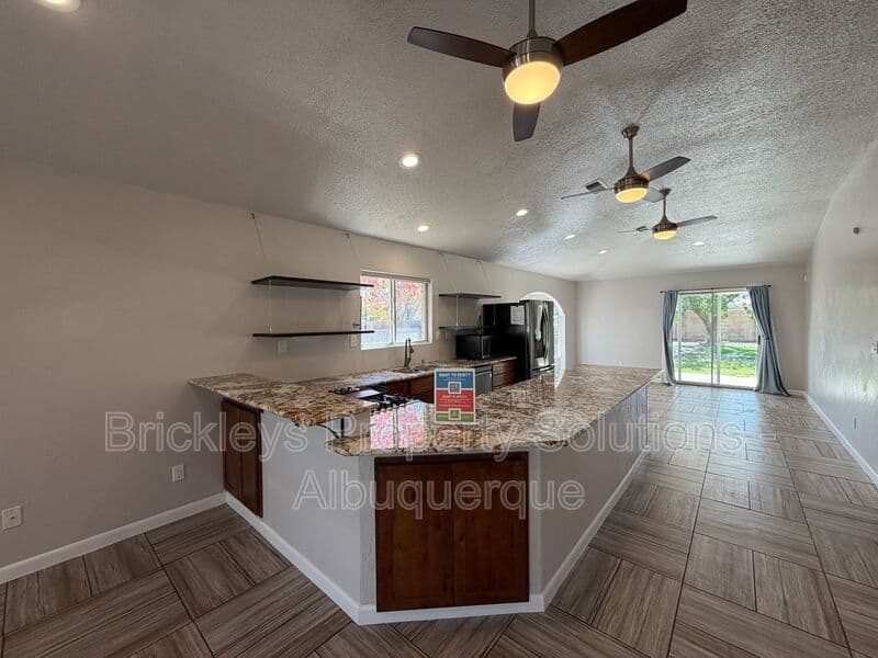 3-bedroom 2-bath home at 7024 Westford Pl NW for $2,200/mo managed by Brickleys Property Solutions Albuquerque — photo 7 of 33