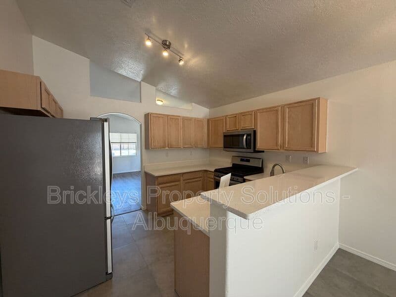 3-bedroom 2-bath home at 6019 Full Moon Ave NW for $1,900/mo managed by Brickleys Property Solutions Albuquerque — photo 8 of 26