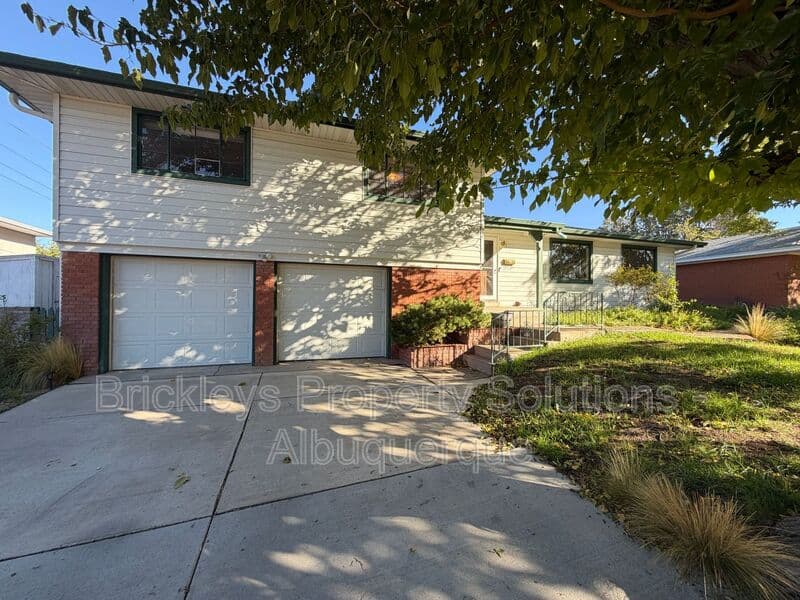 4-bedroom 3-bath home at 7121 Edwina Ave NE for $2,450/mo managed by Brickleys Property Solutions Albuquerque — photo 1 of 47