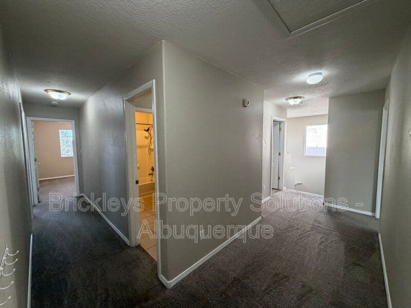 5-bedroom 4.5-bath home at 7008 Tree Line Ave NW for $2,500/mo managed by Brickleys Property Solutions Albuquerque — photo 16 of 43