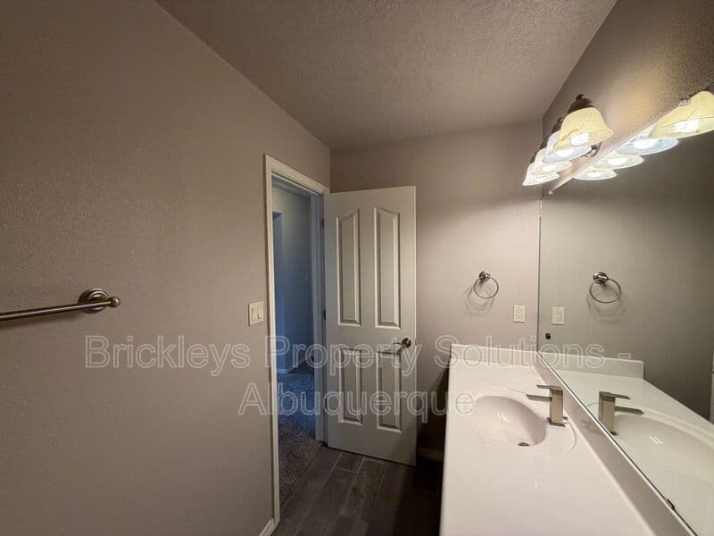 4-bedroom 2.5-bath home at 7420 Tangerine Court NE for $2,450/mo managed by Brickleys Property Solutions Albuquerque — photo 15 of 39