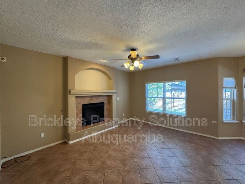 4-bedroom 3-bath home at 7131 Wild Olive Ave NE for $2,900/mo managed by Brickleys Property Solutions Albuquerque — photo 13 of 38