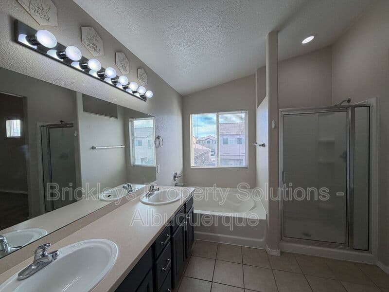 5-bedroom 4.5-bath home at 7008 Tree Line Ave NW for $2,500/mo managed by Brickleys Property Solutions Albuquerque — photo 13 of 43