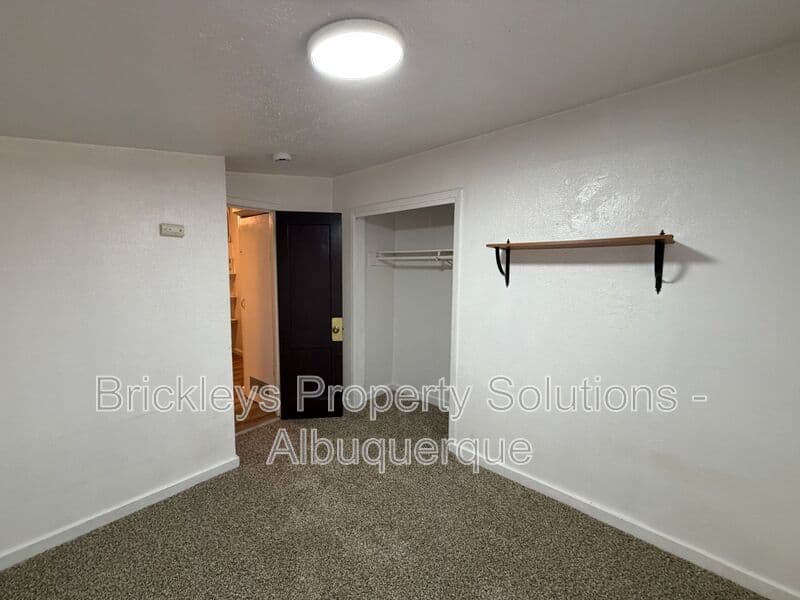 4-bedroom 2-bath home at 313 Cornell Drive SE Unit A for $1,600/mo managed by Brickleys Property Solutions Albuquerque — photo 21 of 27