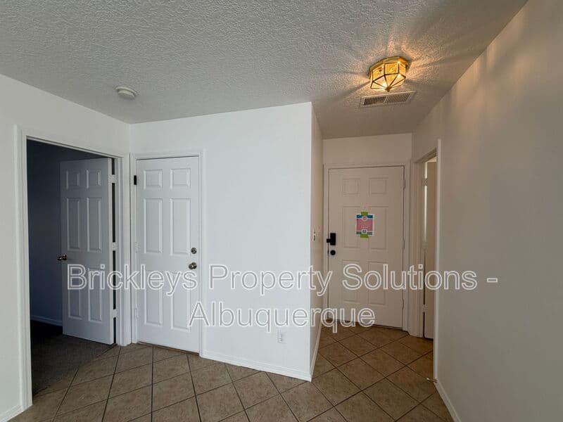 4-bedroom 3-bath home at 6027 Park South Pl NW for $2,400/mo managed by Brickleys Property Solutions Albuquerque — photo 8 of 36