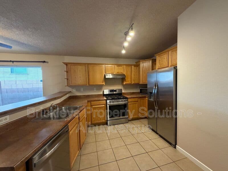 3-bedroom 2-bath home at 1548 Reynosa Loop SE for $1,900/mo managed by Brickleys Property Solutions Albuquerque — photo 6 of 31