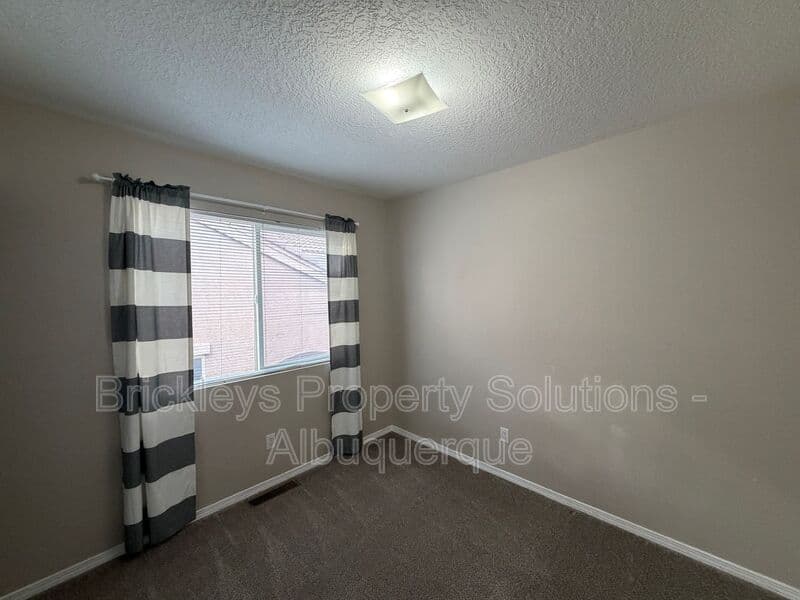 5-bedroom 4.5-bath home at 7008 Tree Line Ave NW for $2,500/mo managed by Brickleys Property Solutions Albuquerque — photo 14 of 43