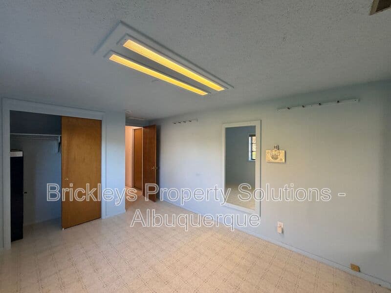 4-bedroom 3-bath home at 7121 Edwina Ave NE for $2,450/mo managed by Brickleys Property Solutions Albuquerque — photo 37 of 47