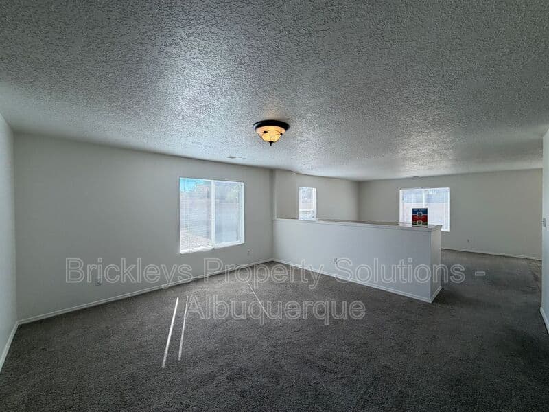 4-bedroom 3-bath home at 6027 Park South Pl NW for $2,400/mo managed by Brickleys Property Solutions Albuquerque — photo 10 of 36