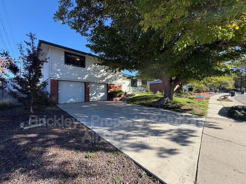 4-bedroom 3-bath home at 7121 Edwina Ave NE for $2,450/mo managed by Brickleys Property Solutions Albuquerque — photo 4 of 47