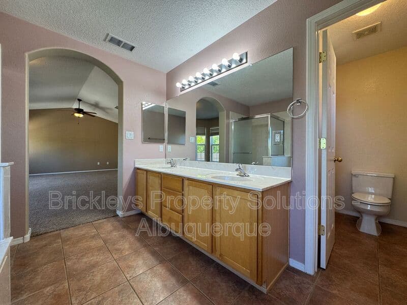 4-bedroom 3-bath home at 7131 Wild Olive Ave NE for $2,900/mo managed by Brickleys Property Solutions Albuquerque — photo 30 of 38