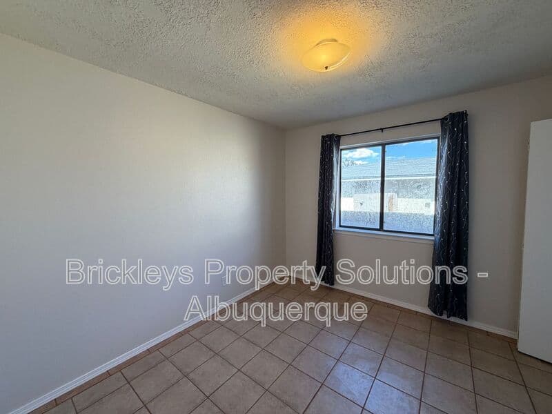 4-bedroom 2-bath home at 5812 Brahma Dr NW for $1,950/mo managed by Brickleys Property Solutions Albuquerque — photo 15 of 35