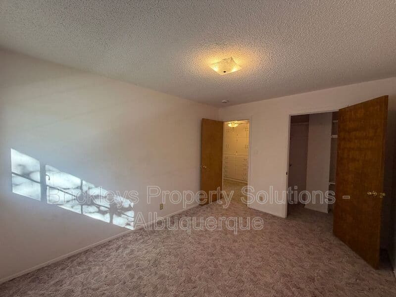 4-bedroom 3-bath home at 7121 Edwina Ave NE for $2,450/mo managed by Brickleys Property Solutions Albuquerque — photo 22 of 47