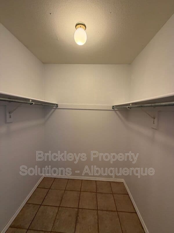 4-bedroom 2-bath home at 5812 Brahma Dr NW for $1,950/mo managed by Brickleys Property Solutions Albuquerque — photo 12 of 35