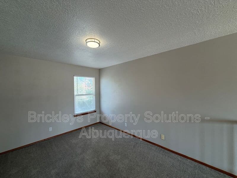 4-bedroom 2.5-bath home at 10331 Dunbar St NW for $2,300/mo managed by Brickleys Property Solutions Albuquerque — photo 7 of 43