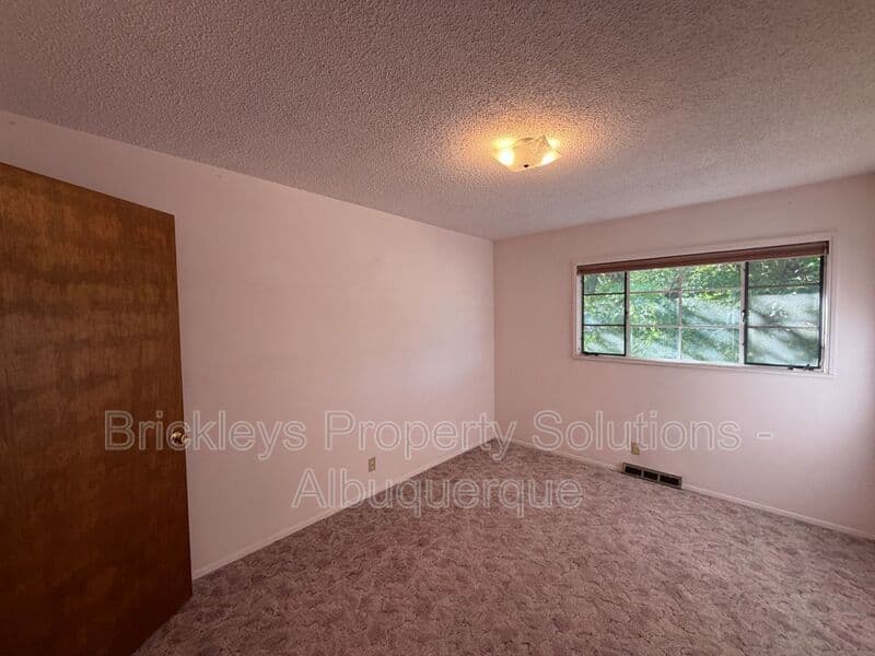 4-bedroom 3-bath home at 7121 Edwina Ave NE for $2,450/mo managed by Brickleys Property Solutions Albuquerque — photo 21 of 47