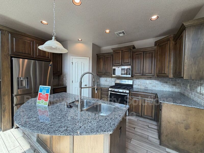 4-bedroom 2.5-bath home at 7420 Tangerine Court NE for $2,450/mo managed by Brickleys Property Solutions Albuquerque — photo 30 of 39