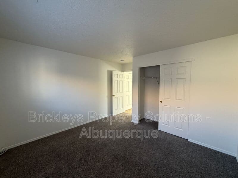 4-bedroom 3-bath home at 6027 Park South Pl NW for $2,400/mo managed by Brickleys Property Solutions Albuquerque — photo 27 of 36