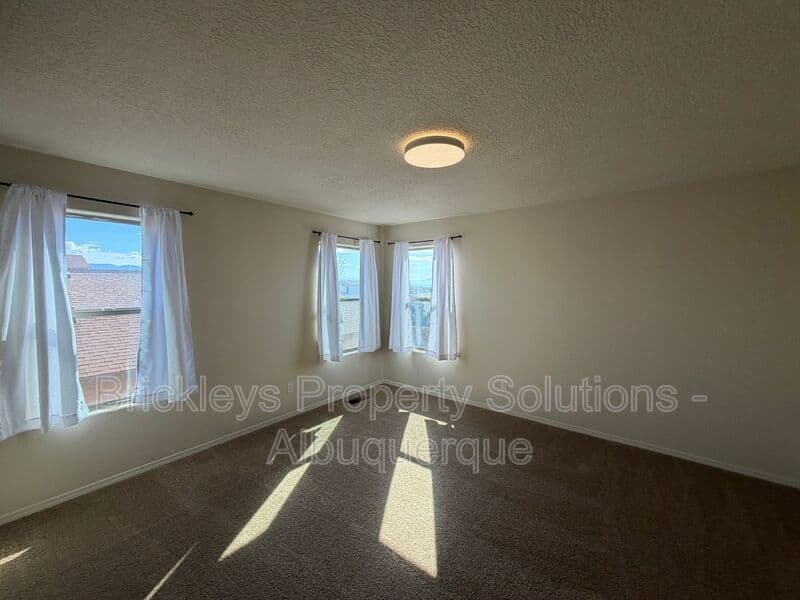 4-bedroom 3.5-bath home at 6228 Nacional Rd NW for $2,700/mo managed by Brickleys Property Solutions Albuquerque — photo 12 of 44