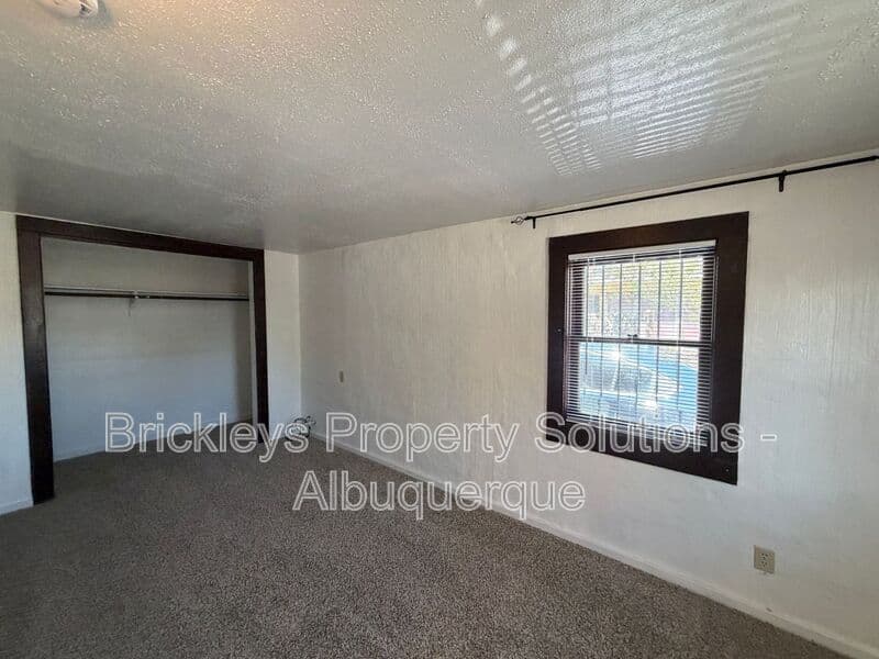 4-bedroom 2-bath home at 313 Cornell Drive SE Unit A for $1,600/mo managed by Brickleys Property Solutions Albuquerque — photo 6 of 27