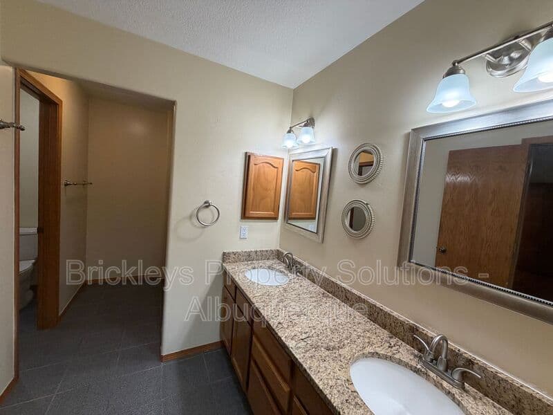 3-bedroom 2.5-bath home at 9600 Allande Rd NE for $3,200/mo managed by Brickleys Property Solutions Albuquerque — photo 30 of 40